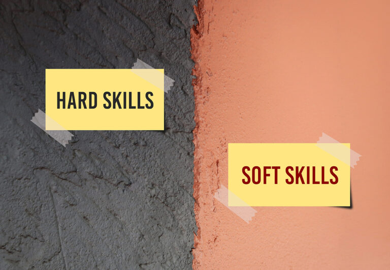 Hard grey and orange wall with text written note HARD SKILLS (teachable and measurable abilities such as writing, or computer) contrast to SOFT SKILLS (traits of good employee such as communication)